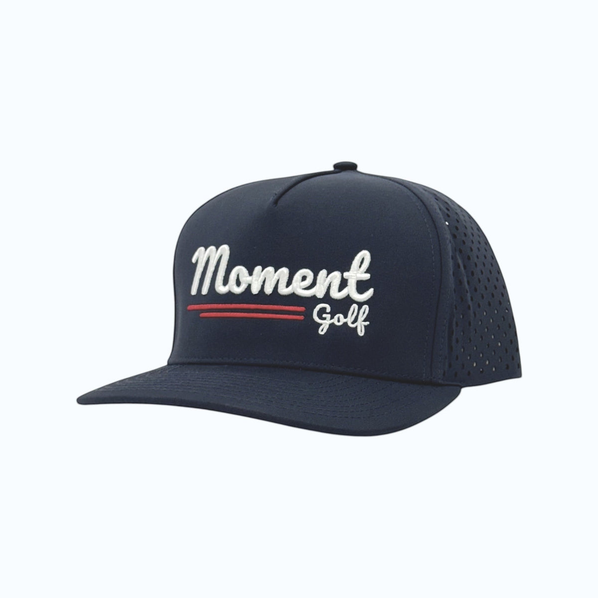 Moment Golf navy blue 5-panel performance hat with laser-perforated side panels and embroidered script logo