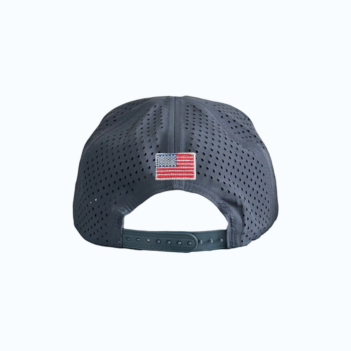Moment Golf navy blue 5-panel performance hat with laser-perforated side panels, snapback closure, and American Flag patch