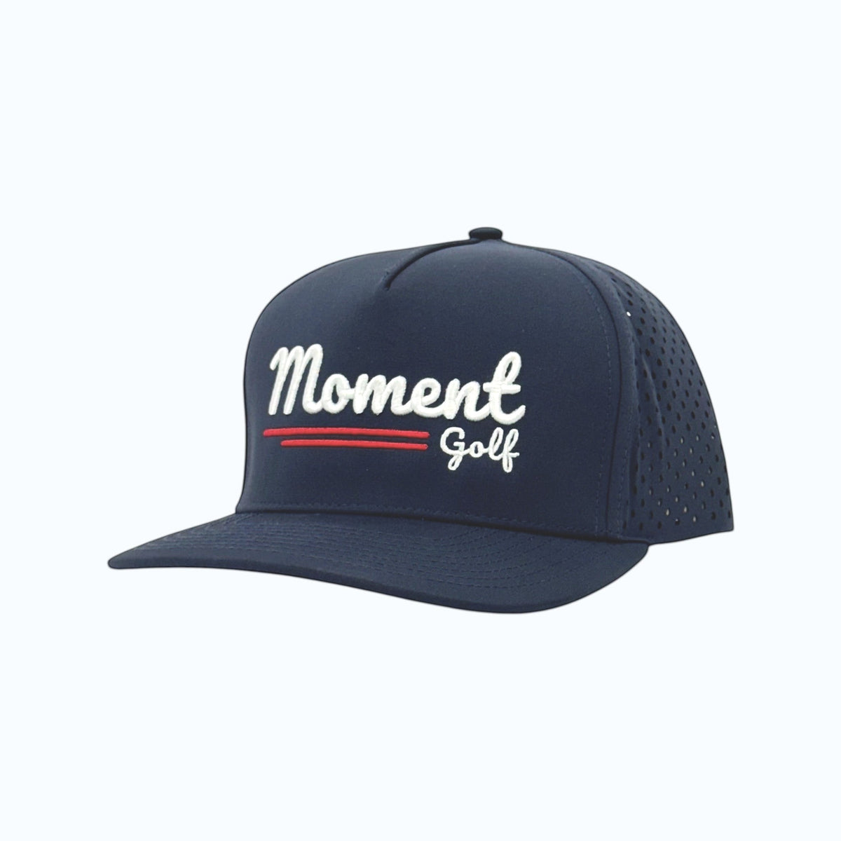 Moment Golf navy blue 5-panel performance hat with white embroidered script logo and laser-perforated side panels.