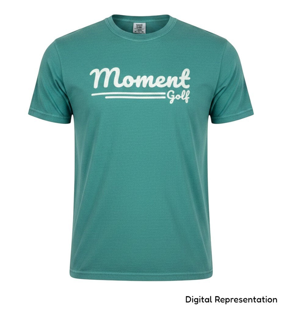 Moment Golf premium short sleeve t-shirt in garment-dyed teal cotton with a white scripted logo on the chest.