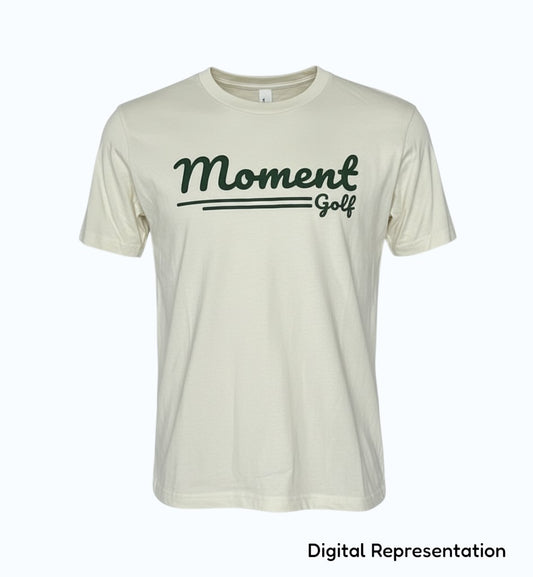 Moment Golf youth short sleeve t-shirt in cream ringspun cotton with a forest green scripted logo graphic